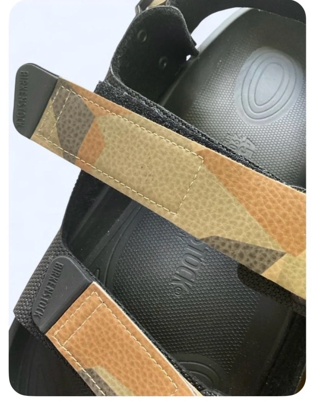 Birkenstock Men’s Black Slides with Tan Accent Strap